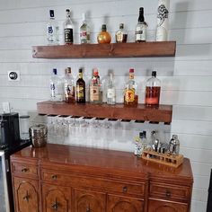 a bar with liquor bottles and glasses on it