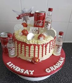 a cake decorated with coca - cola and vodka bottles