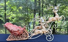 two wooden sleighs sitting on top of a table