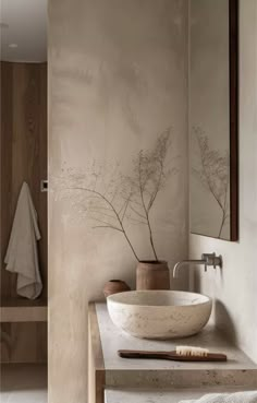 a bathroom with two sinks and a mirror