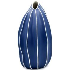 a blue vase with white lines on the outside and inside, sitting in front of a white background