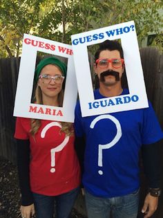 two people wearing funny costumes with question marks on their faces and one has a fake moustache