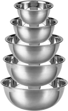 a stack of metal bowls sitting on top of each other