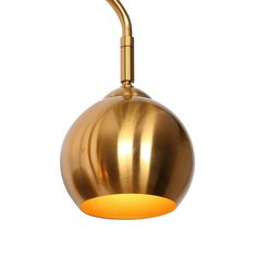 a gold colored light fixture on a white background