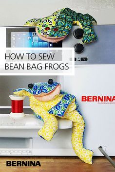 a stuffed frog sitting on top of a sewing machine with the words how to sew bean bag frogs