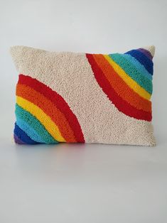 a multicolored pillow on a white background