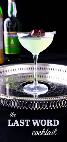 the last word cocktail is served in a martini glass with an olive garnish