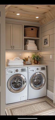 a washer and dryer in a small room