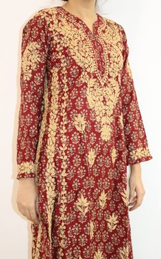 Introducing our beautiful Navya A-line Kurta. Crafted with precision, this kurta features two kali panels that create a graceful silhouette. The entire ensemble is adorned with stunning contrast gold Chikankari embroidery, adding a touch of opulence to every detail. Designed for both sophistication and comfort, this kurta boasts an A-line shape that drapes gracefully, flattering every figure. The intricate Chikankari embroidery in gold thread showcases the artistry and craftsmanship that goes into creating this masterpiece. Embrace the richness of tradition in a contemporary form as you step out in this mesmerizing ensemble. Length - 48 inches Sizes -  S - fits bust 34 M - fits bust 36 L - fits bust 38 XL - fits bust 40 0X - fits bust 42 1X - fits bust 44 Machine wash cold. Line dry, Light Gold Embroidered Raw Silk Palazzo Set, Silk Kurta With Resham Embroidery For Diwali, Eid Palazzo Set With Gold Embroidery And Straight Kurta, Navratri Raw Silk Kurta With Intricate Embroidery, Festive Palazzo Set With Gold Embroidery For Eid, Diwali Traditional Wear Straight Kurta With Gold Embroidery, Diwali Straight Kurta With Gold Embroidery, Diwali Traditional Wear With Gold Embroidery Straight Kurta, Chanderi Kurta With Gold Embroidery Long Sleeve