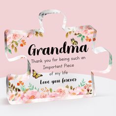 a pink box with flowers and butterflies on it that says grandma thank you for being such an important piece of my life