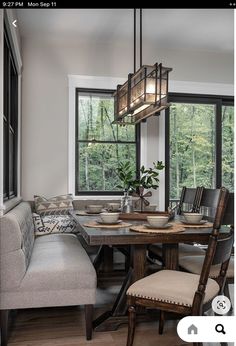 the dining room table is set with place settings for four people to sit and eat