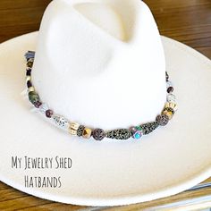 Looking to add some glam to your hat? This beautiful, hand beaded hat band is fully adjustable for a custom fit for your hat. Gorgeous mix of Natural Stones and with various mixed metal Boho style beads for uniqueness! Strung on Brazilian waxed linen cord with leather cord ties. If you are looking to add a little special touch to your cowboy hat, this gorgeous hat band is perfect for that! Makes a great Birthday or Christmas gift for hat lovers! It looks great on a cowboy hat or straw hat. Perfect for a Western Cowgirl Wedding! ONLY ONE HATBAND OF THIS KIND AVAILABLE! Hat NOT included. Used only for photography purposes.  LISTING IS FOR HATBAND ONLY!!  Adjustable- Hatband is adjustable and ties with waxed linen cording.  TIP: If hat band will be added to your hat permanently, we suggest ta Beaded Hat Bands Diy, Cowboy Hat Bands Diy, Hat Bands Diy, 30 Year Anniversary Gift, Bead Hat, Cowboy Hat Bands, Hat Decor, Beaded Hat Bands, Cowgirl Wedding