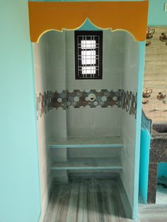 the inside of a bathroom with tiled walls and flooring, including a shower stall