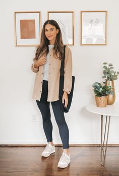 ashley wearing a gray tee, tan shacket, black leggings, and white and tan leather sneakers with black tote bag over her shoulder; in the background, a white round side table with 2 plants and 3 prints in gold frames on a white wall Athleta Outfits, Everyday Outfits Fall, Shacket Outfit, Fall Outfit Ideas, Capsule Outfits, Fall Winter Wardrobe, Fall Capsule Wardrobe, Fashion Mistakes, Casual Winter Outfits