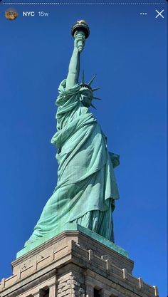 the statue of liberty is shown against a blue sky