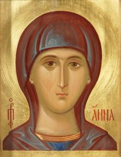 an icon of the mother of jesus, who is depicted in gold and red paint