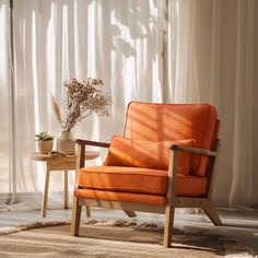 an orange chair sitting in front of a window next to a table with a vase on it