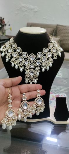 *Beautiful Premium Quality Kundan Choker With Monalisa Stone *Combination Of Kundan, Monalisa Stones And Chini Pearls *Necklace Fitting Is Adjustable *Earring Closure: Push Back White Studs will be sent in this price only if you buy any of the choker ( In case you don't purchase any of the choker you can't get the studs only . These studs will be given only when you purchase the choker ) **Necklace Closure : Beautiful Silk Thread *It is a Bridal or Partywear Set. *It Will Give You a Unique and B Elegant Kundan Bridal Earrings For Wedding, Gold Hand Set Bridal Earrings For Wedding, Gold Hand-set Bridal Earrings For Wedding, Festive White Jewelry Sets With Elegant Design, White Festive Jewelry Sets For Formal Occasions, Festive White Jewelry Sets For Formal Occasions, Festive White Bridal Earrings With Elegant Design, Festive White Formal Jewelry Sets, Gold Jewelry Sets For Wedding