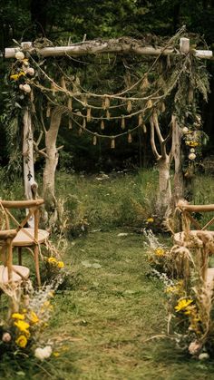 an outdoor ceremony set up with wooden chairs and flowers