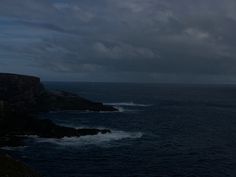 the ocean is very dark and stormy at night