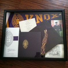 the inside of a frame with some papers and other items in it on top of a wooden table