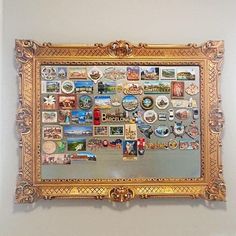 a gold framed mirror with many different pictures on the front and back of it's frame