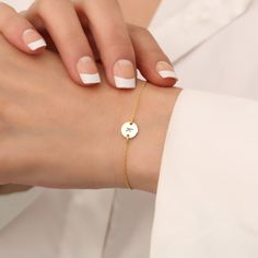 Super Dainty Initial Bracelet, Personalized Tiny Disk Bracelet, Delicate Handmade Jewelry, 14k Gold Plated Circle Bracelet, Dainty Pendant. ✨ Welcome to our enchanting boutique! Discover the epitome of elegance with our Super Dainty Initial Bracelet! 💖 🌸 Each piece is meticulously crafted by skilled artisans, ensuring every detail of our Personalized Tiny Disk Bracelet exudes exquisite craftsmanship. 🌸 🎀 Elevate your accessory game by customizing it with your selected initial, making this pi Dainty Engraved Gold Adjustable Bracelet, Adjustable 14k Gold Charm Bracelet, Dainty Engraved Round Bracelets, Adjustable Engraved Gold Bracelet, Engraved Adjustable Gold Bracelet, Adjustable Chain Bracelet, Delicate Adjustable Round Charm Bracelet, Gold Round Chain Bracelet For Friendship, Elegant Round Name Bracelet For Friendship