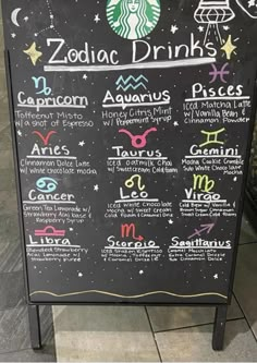 a menu for zodiac drinks on a blackboard