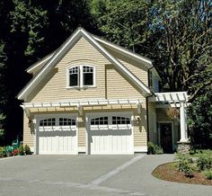 a two car garage with an attached porch