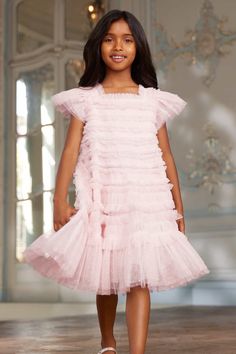 Description & Details The Lisette KIDS Dress in Peony Pink. This dress is beautifully designed with a signature Needle & Thread textile. Crafted with a playful, frothy texture created using soft tulle panels gathered to create an all over pretty effect. Designed with short sleeves and underlayers of tulle to create a generous volume skirt. The perfect dress for your little one's upcoming occasions. - Kisses tulle decorated with layers of kisses tulle ruffles - Bodice and skirt are fully lined, s Volume Skirt, Tulle Ruffles, Full Tulle Skirt, Peony Pink, Soft Tulle, Needle Thread, Tulle Fabric, Dope Outfits, Lining Fabric