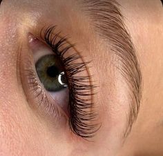 a woman's eye with long lashes