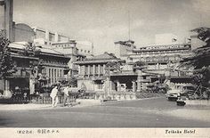 an old black and white photo of some buildings