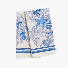 two blue and white towels with starfishs on them