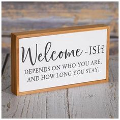 a wooden sign that says, welcome - ish defends who you are and how long you stay