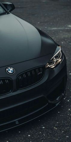 the front end of a black bmw car