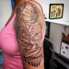 a woman with a cupcake tattoo on her arm