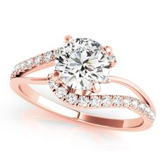 a rose gold engagement ring with diamonds on it