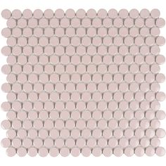 a white and pink tile with circles on it