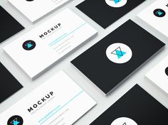 several business cards with different shapes and sizes, all in black and white color scheme