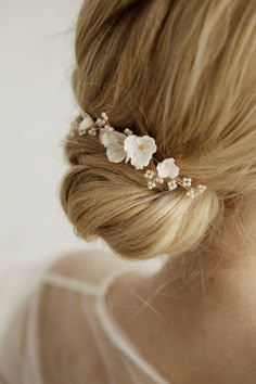 Delicate and stunning floral comb is crafted with handmade Porcelain flowers and small matte beads. Use this flower hair comb to accentuate an updo or add a whimsical touch to loose waves. So small the comb is well attached and holds even on short hair (if necessary, it can be fixed with a bobby pin). This bridal hair piece is versatile and can complement any wedding gown design. Available on silver and gold wire. Length: 9 cm ( 3.5 inch) If you like this bridal hair comb, I recommend that you s Bridal Hair With Hair Comb, Bridal Hair Accessories Updo, Wedding Bun With Flowers, Low Bun Wedding Hair With Flowers, Flower In Hair Wedding, Gold Hair Piece Wedding, Boho Wedding Hair Flowers, Bride Hair Comb, Flower Head Piece