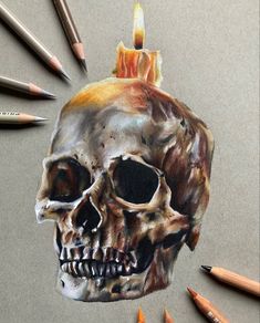 a drawing of a human skull with a candle on it's head, surrounded by colored pencils