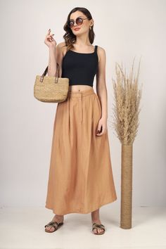 "Beige Pleated Maxi skirt for women skirt, Long skirt, Custom made, Made to order, Plus size -Model height: 5'7\" wearing size S -Length: 38\" -Fit: A-line -Closure: Front button and zipper" High Waist Flowy Brown Skirt, Brown Long Skirt With Lining, Long Brown Lined Skirt, Brown Long Lined Skirt, Brown Midi Skirt For Summer, Summer Wrap Skirt With Gathered Detail, Relaxed Brown Maxi Skirt For The Beach, Fitted Brown Wrap Skirt For Summer, Brown Relaxed Fit Maxi Skirt For Beach