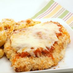 chicken parmesan with macaroni and cheese on a plate