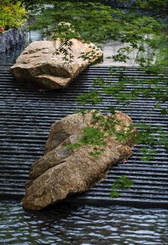 two large rocks sitting on top of a grill