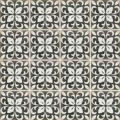 a black and white tile pattern with an intricate design in the center, on a beige background