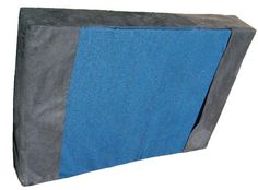 a blue and gray bag sitting on top of a white surface