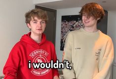 two young men standing next to each other in front of a wall with the words i wouldn't