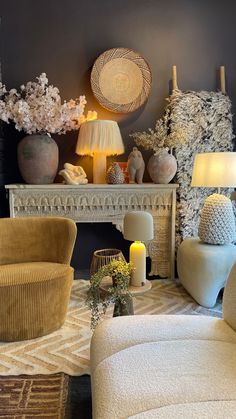 a living room filled with lots of furniture and flowers on top of a fireplace mantel