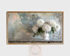 a vase with white flowers is sitting on a ledge in front of a wallpapered background