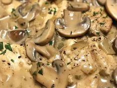 mushrooms are being cooked in a creamy sauce